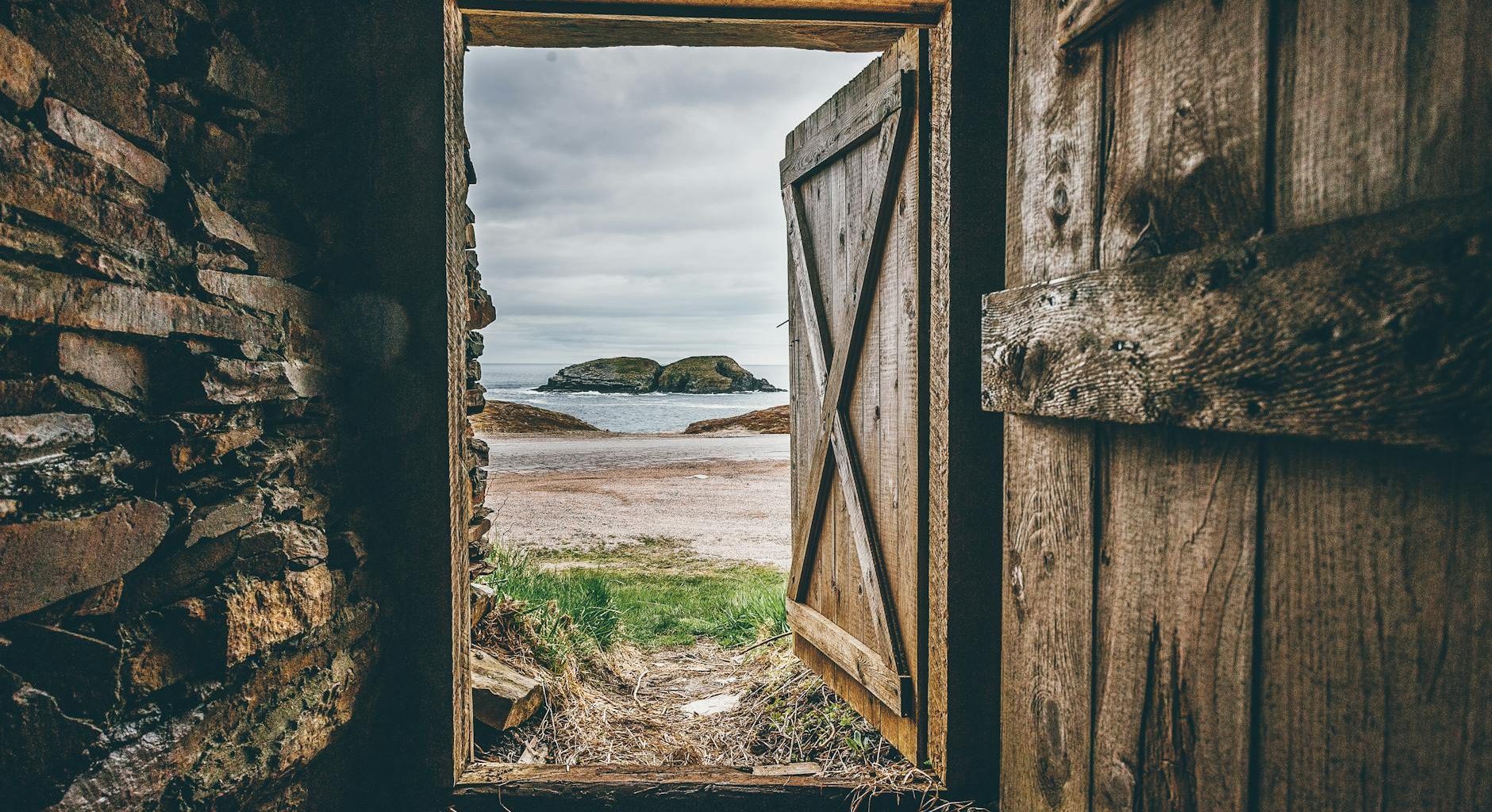 brown wooden opened door shed