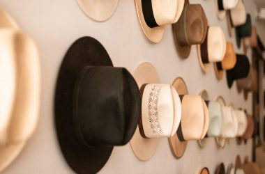 fedora hats hanging on the wall