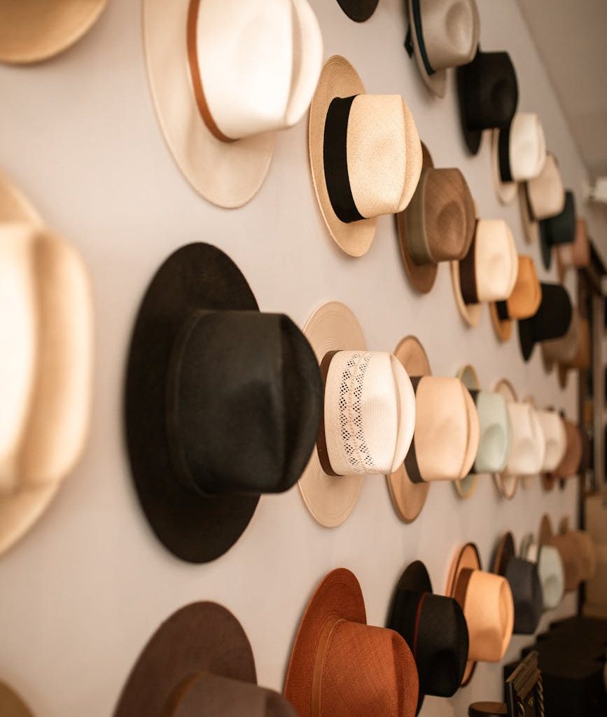 fedora hats hanging on the wall