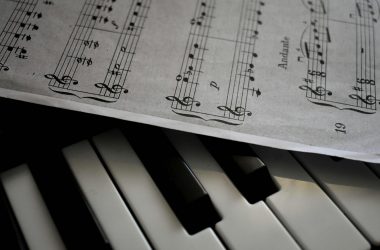close up shot of musical notes and piano keys