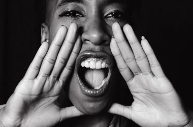 grayscale photo of a woman shouting